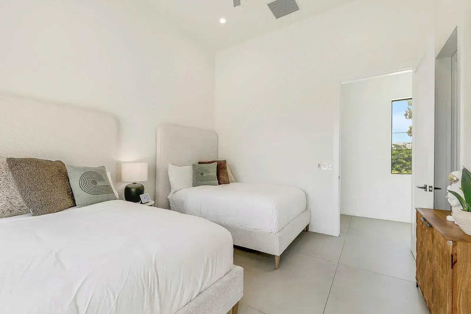 A white guest suite with linen bedding