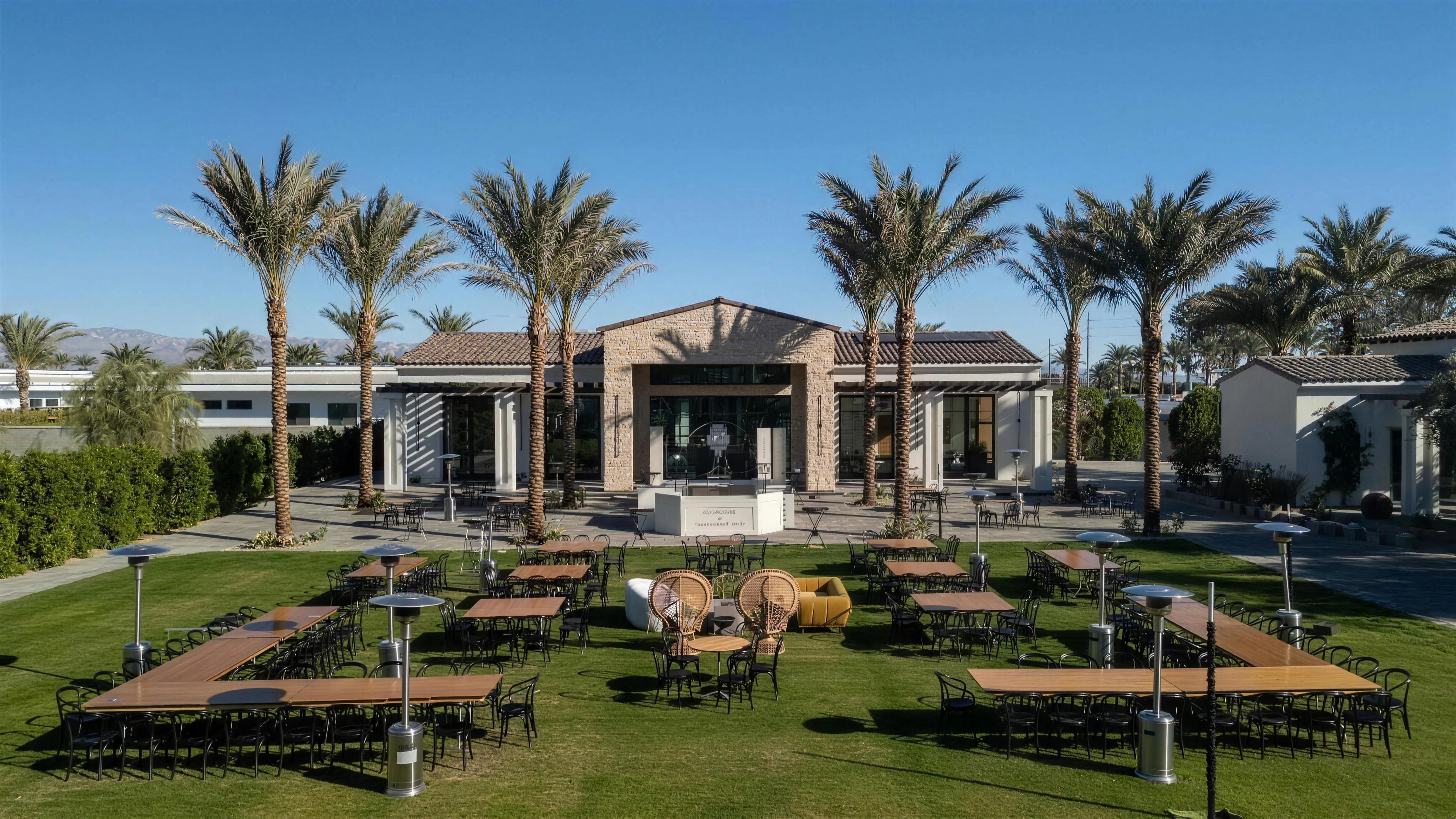 Long banquet tables set across the great lawn for a corporate event