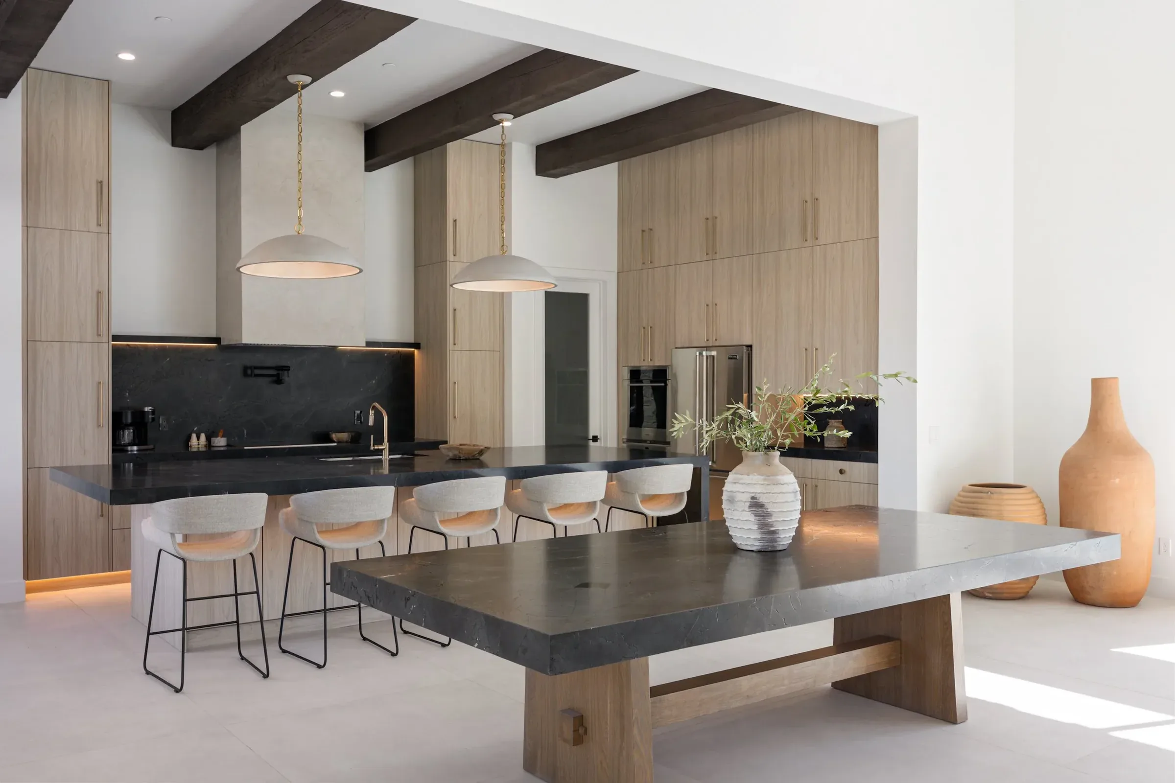 Chef's kitchen with dark stone island