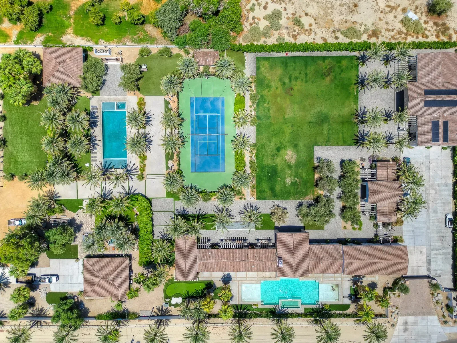 Directly above the courts and pools