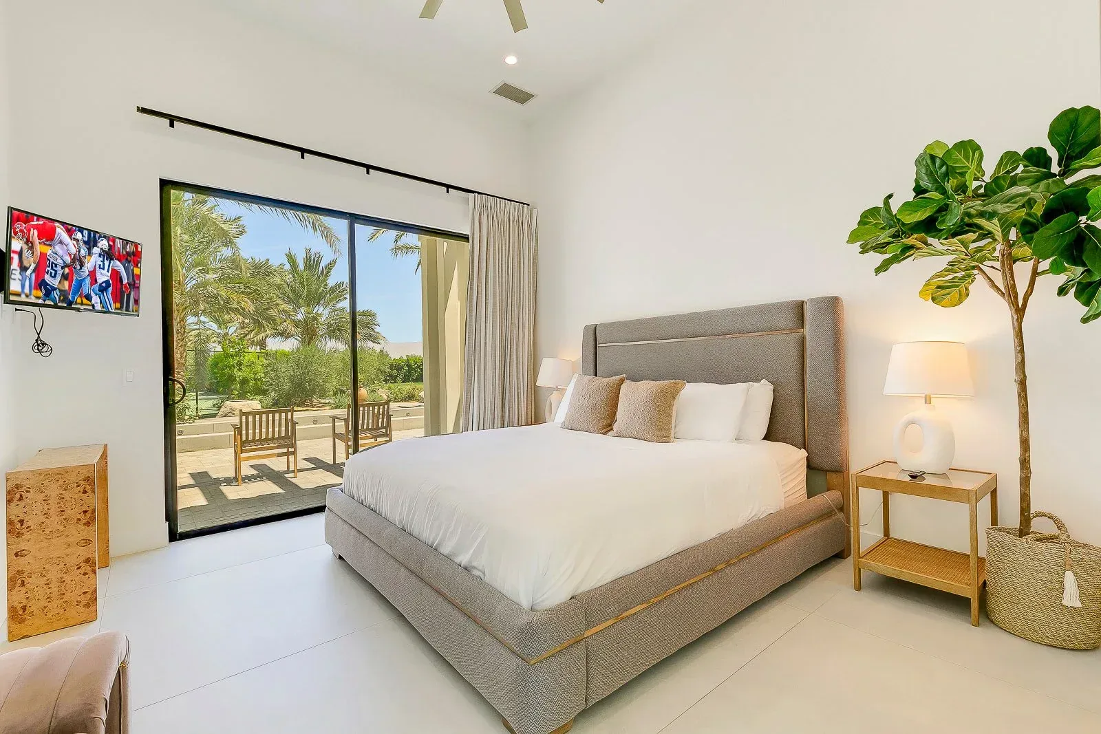 A guest bedroom in linen and oak