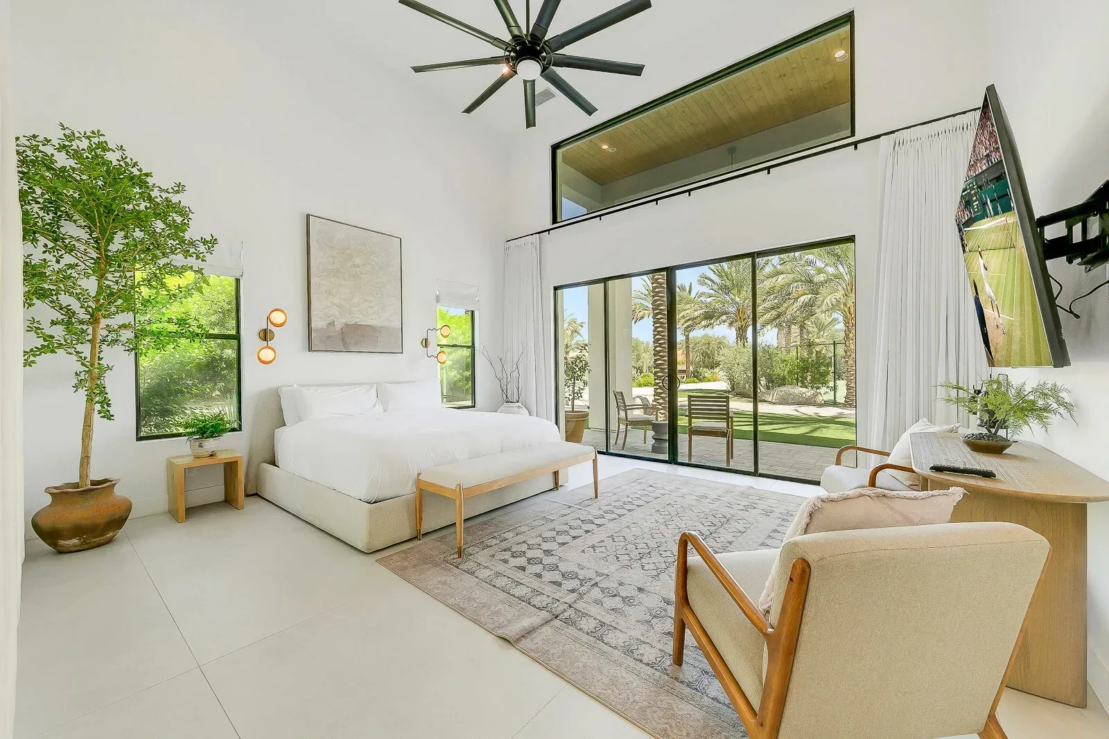 A bright suite with a courtyard tree