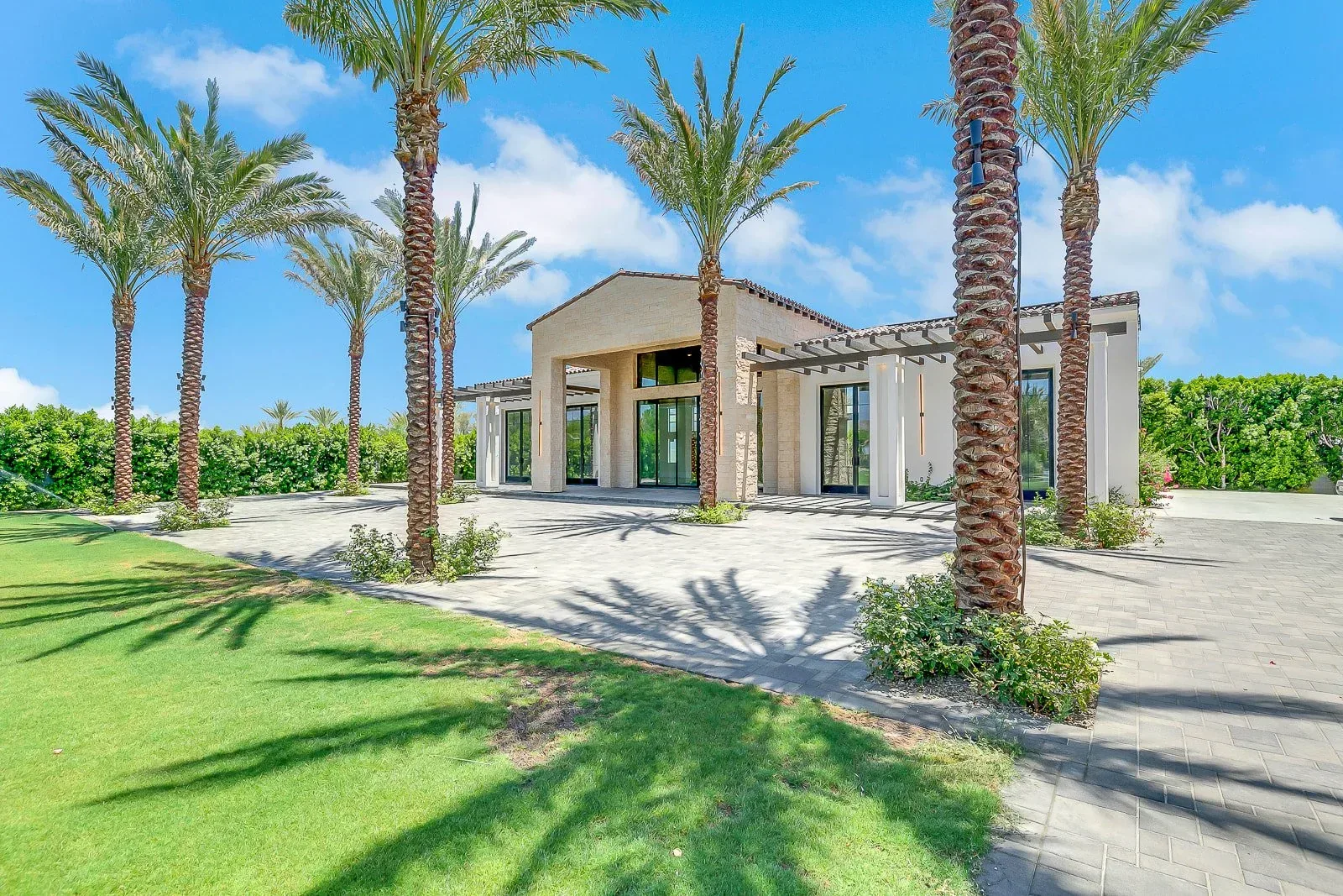 Lawn and palms at the west edge