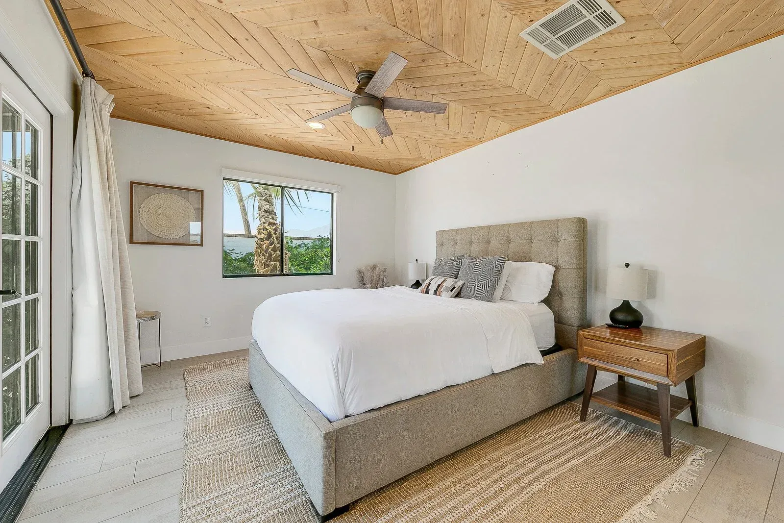 A guest room under a timber ceiling