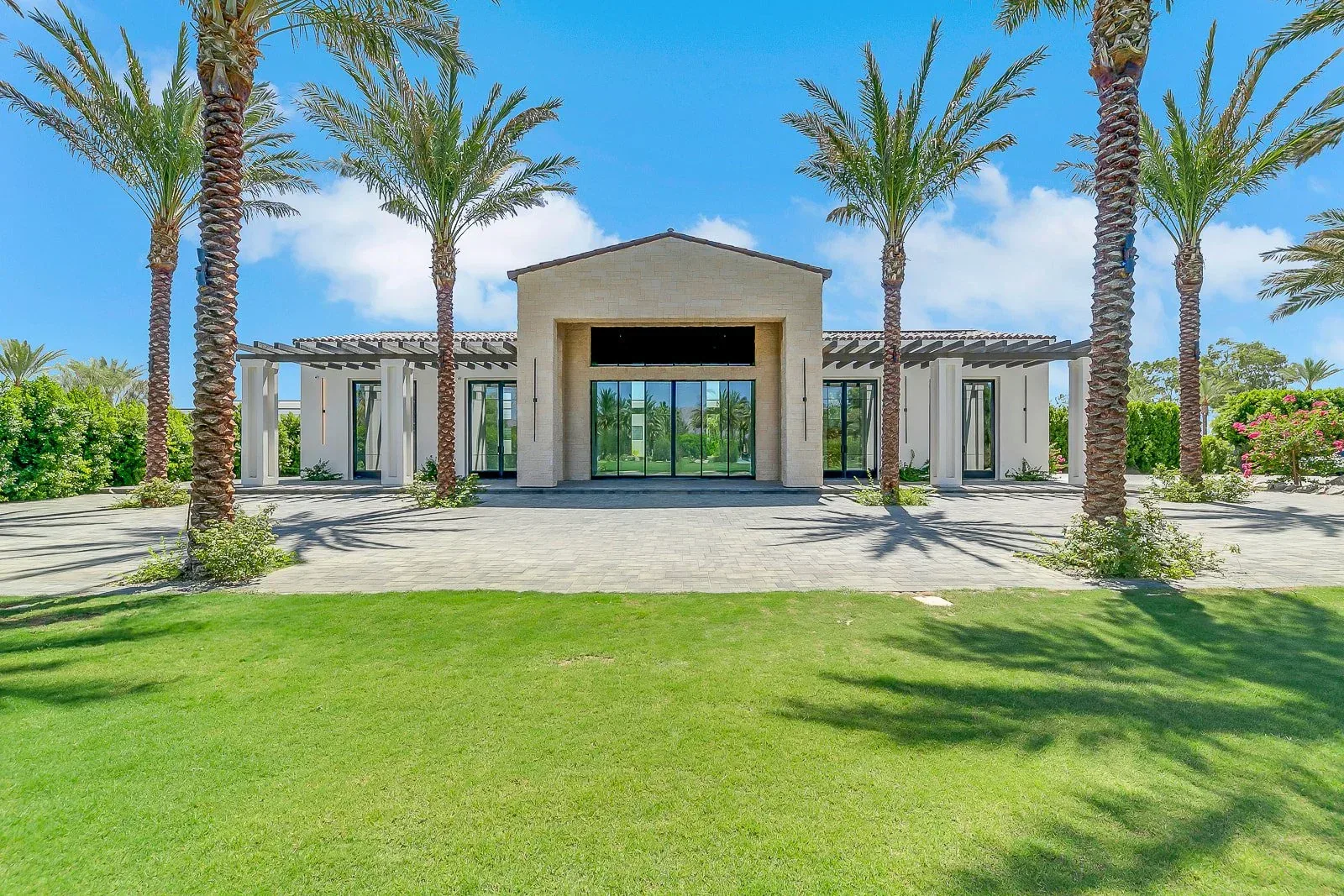 The front elevation across the lawn