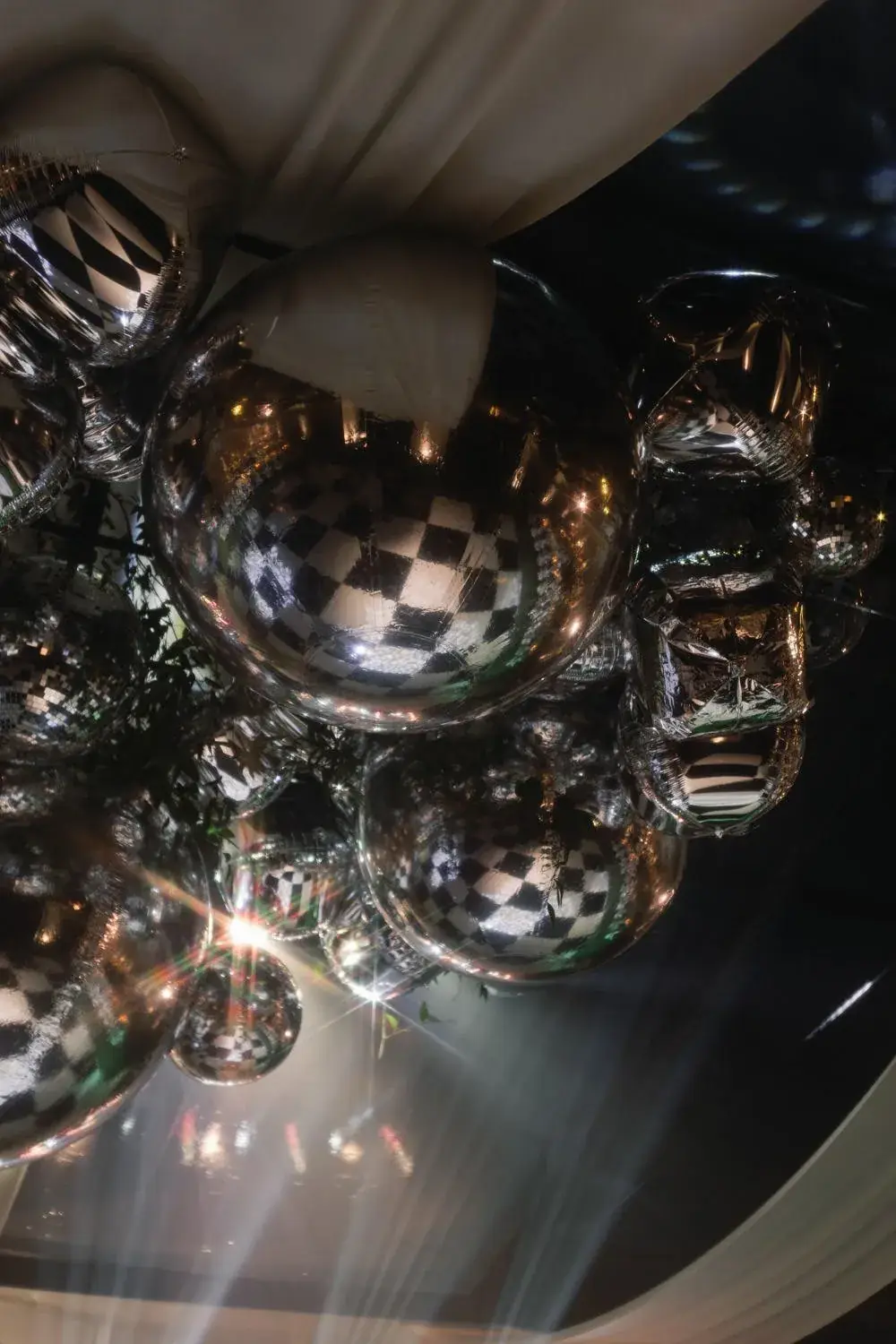 A ceiling of hanging disco balls