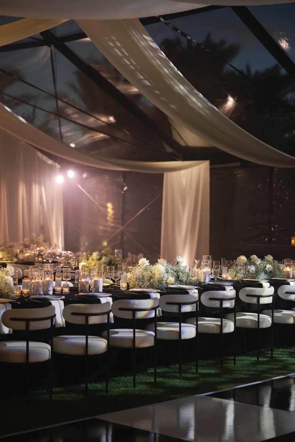 A tented reception in black and white